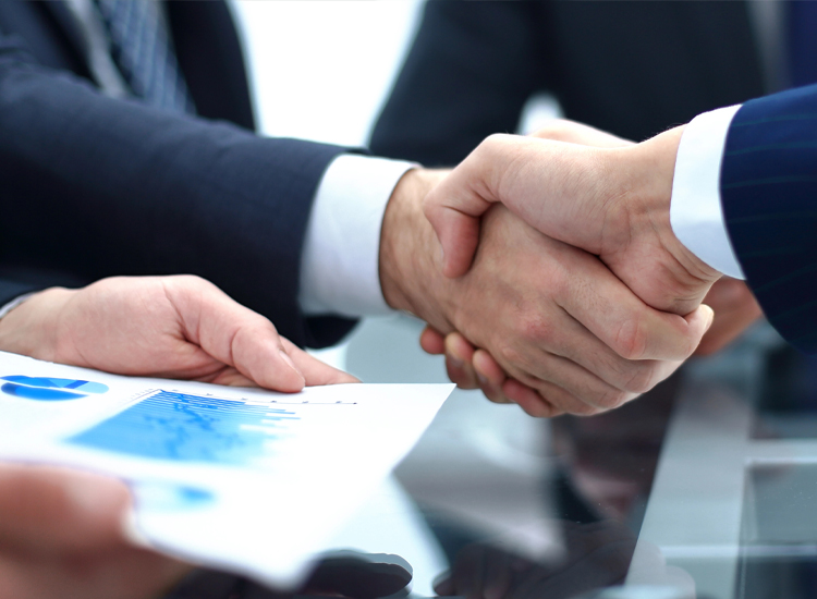 Men shaking hands after getting commercial business insurance in Coppell, TX