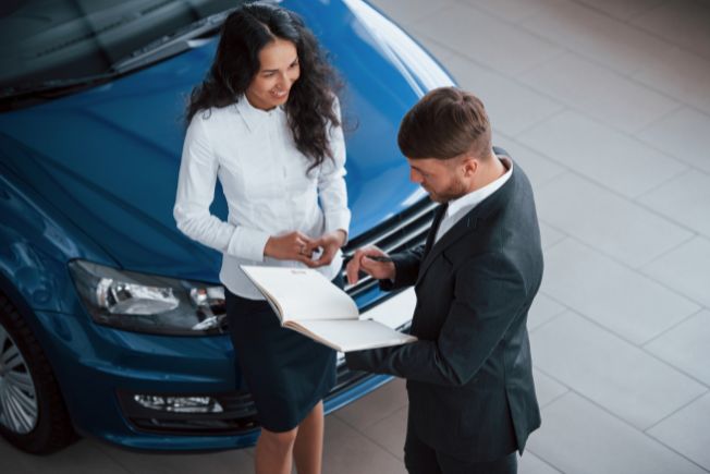 Woman in Spring, TX discussing a vehicle insurance policy with an agent
