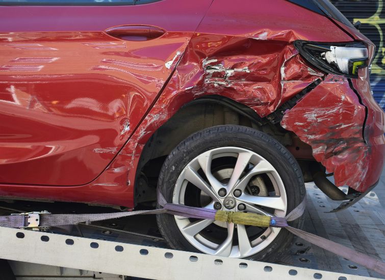 Car in Montgomery County with auto insurance being towed after an accident