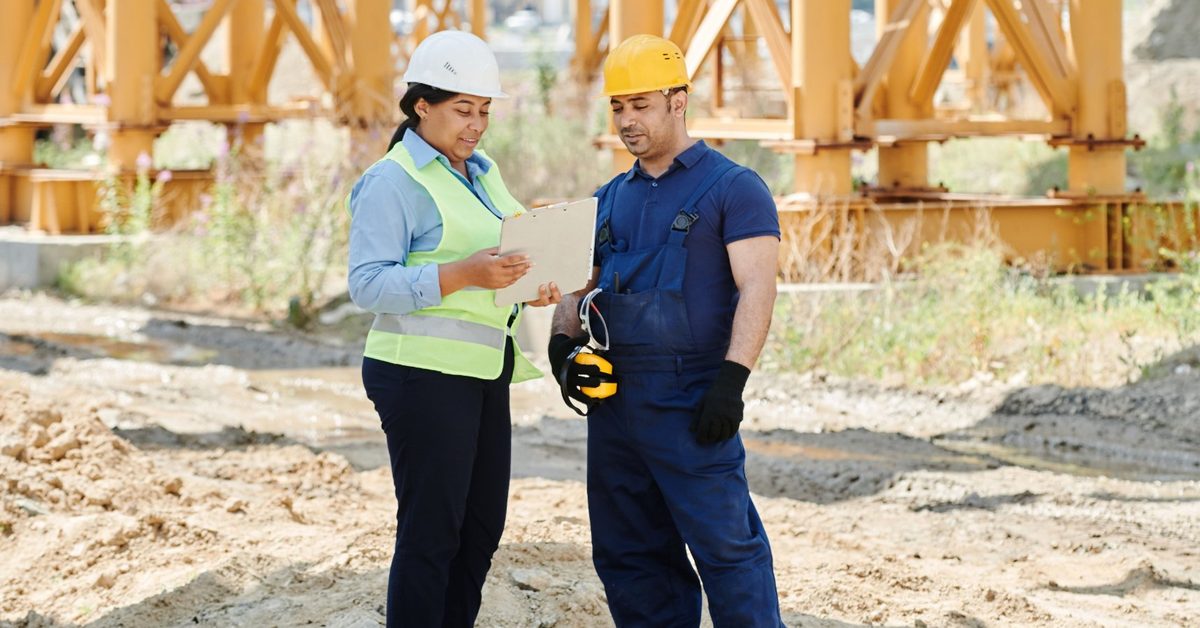 Contractor reviewing a certificate of insurance on a job site