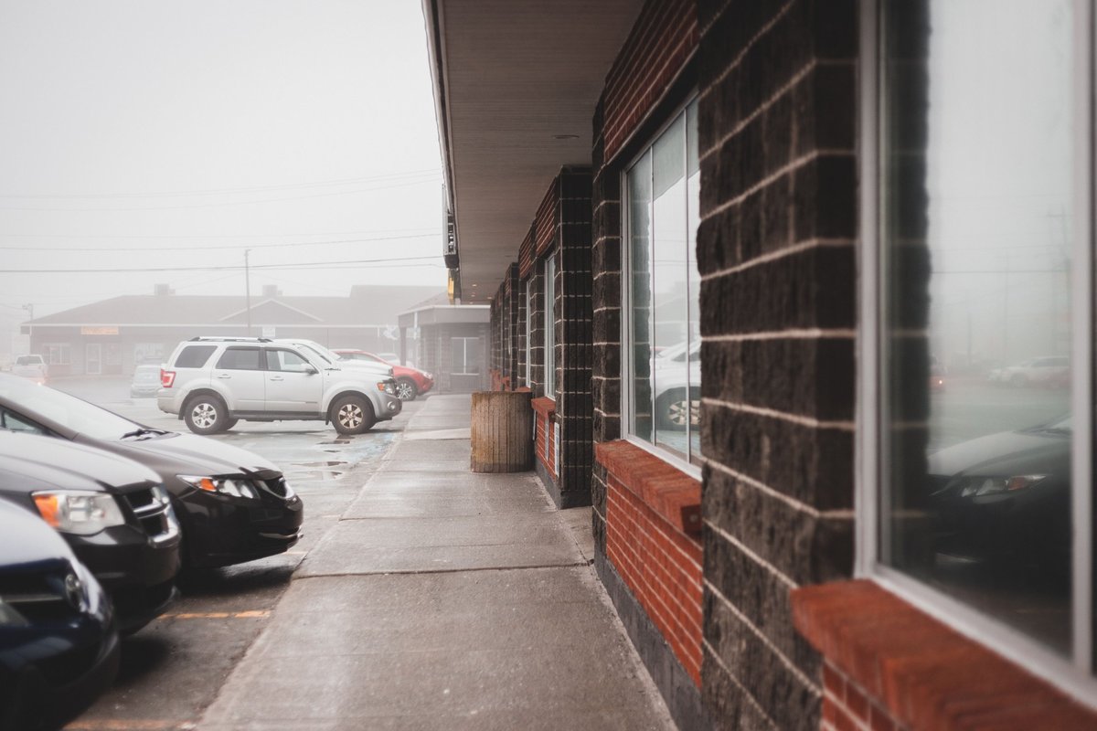 Older strip center building covered by lessor's risk insurance in DFW